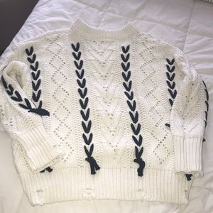 White sweater with distressed look